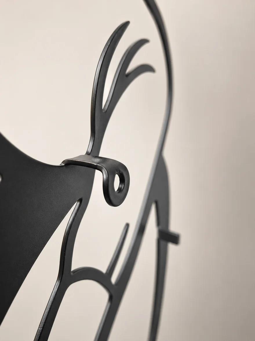 Close-up of the folded hanging tab with its mounting hole