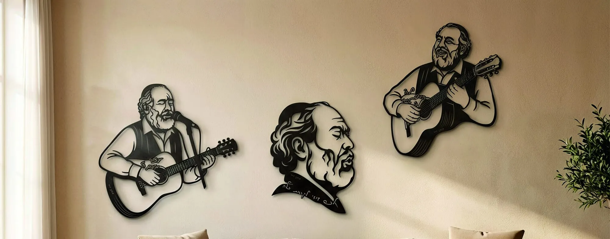 Three Rabbi Shlomo Carlebach portraits hanging on a bright wall